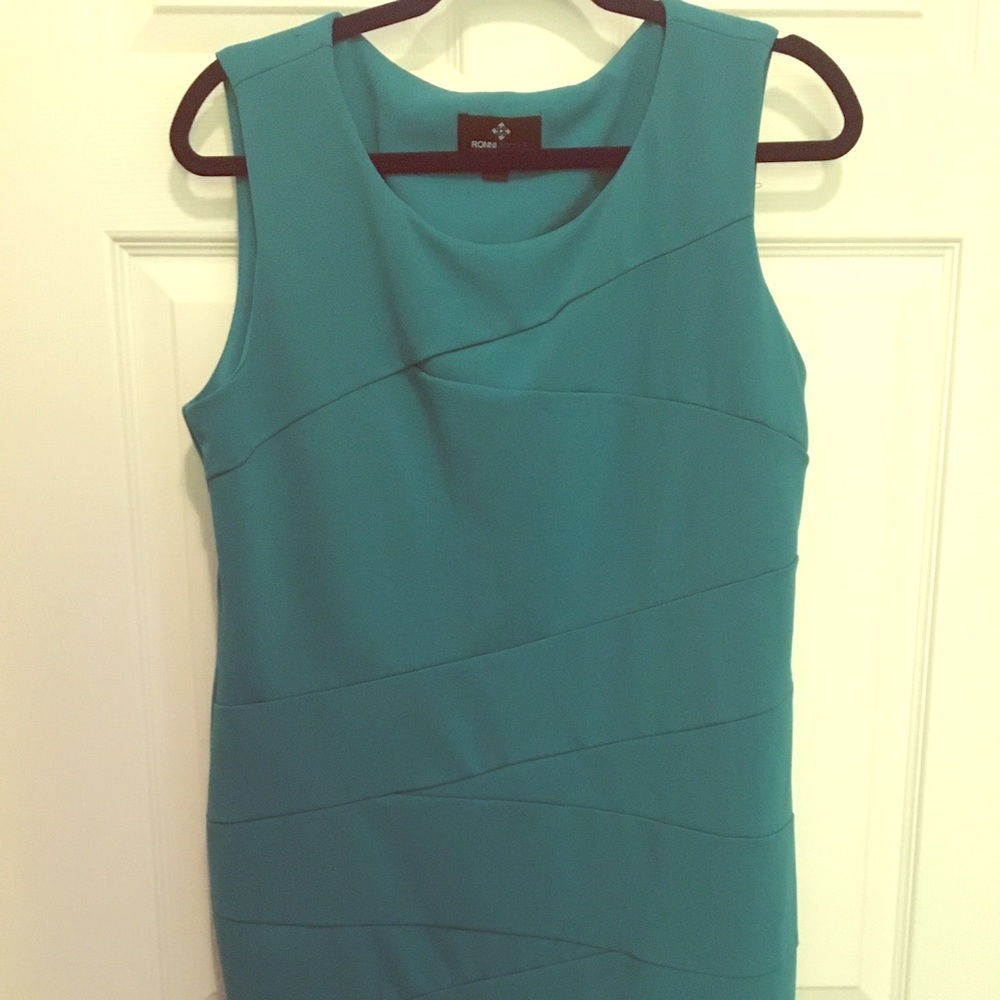 Fitted teal work dress.